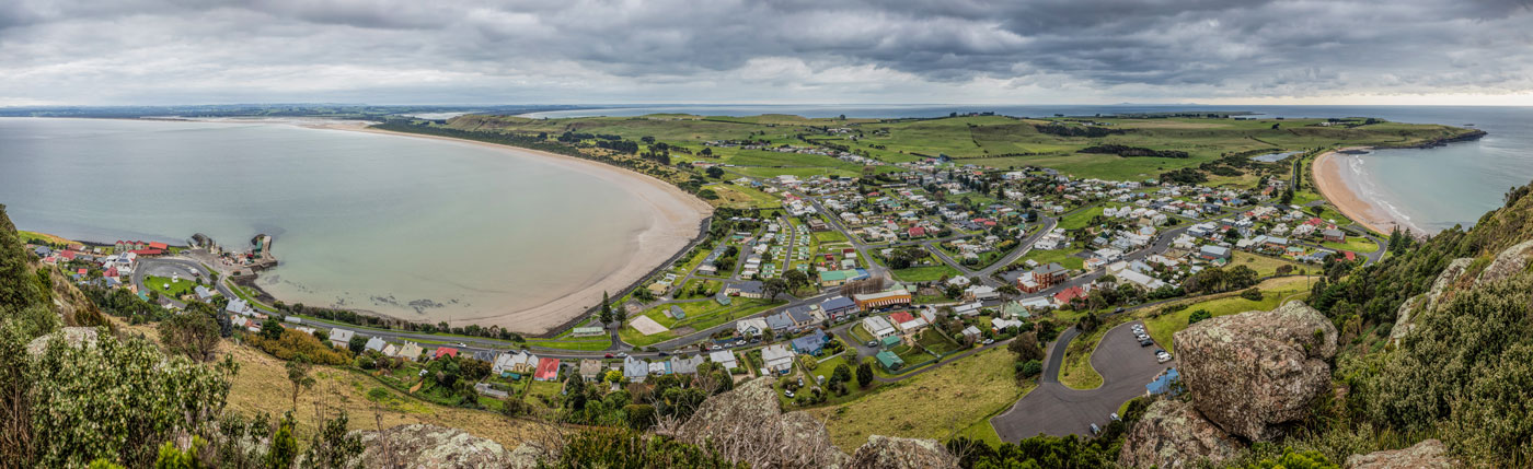 Panoramic view of Stanley, an small fihing town in north west Tasmania as seen from the Nut. by Michael Evans. Coastline Tours Tasmania